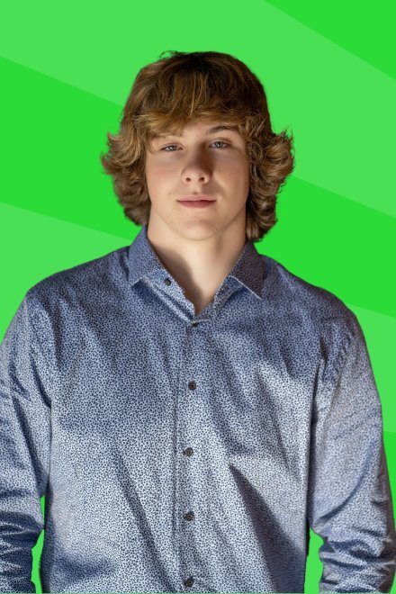 Mac Parkman smiling in a blue button-down shirt