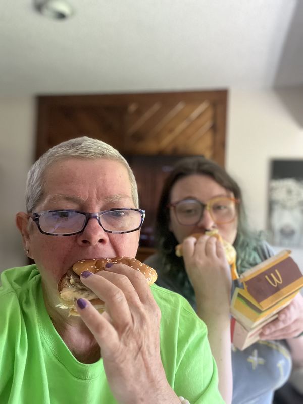 Supporter and child with Big Macs