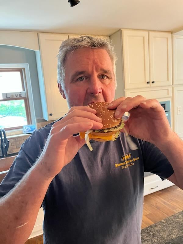 Young man pointing at a Big Mac box