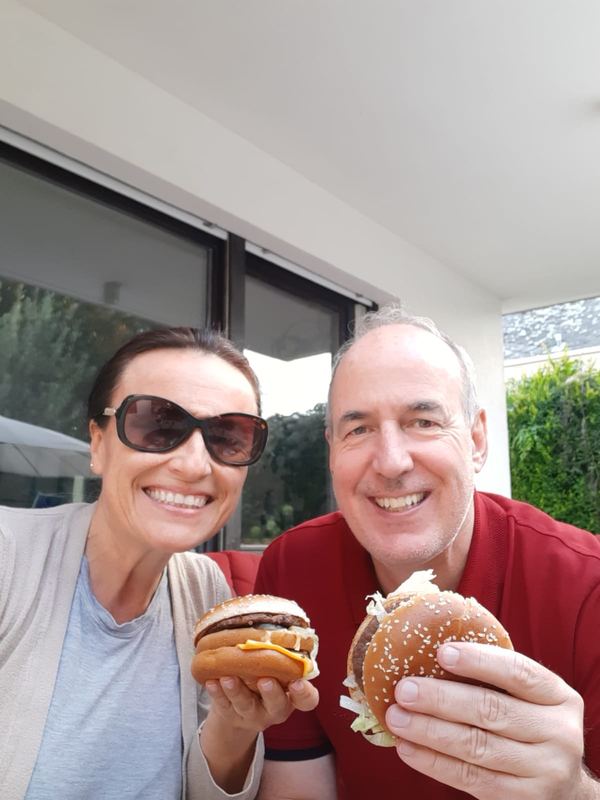 Couple holding Big Macs