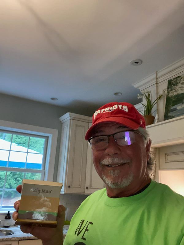 Supporter with McDonald's fries in a green shirt