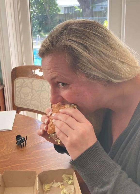 Supporter taking a big bite of a Big Mac