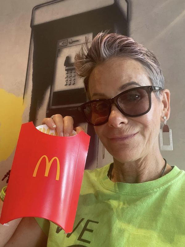 Supporter eating a Big Mac at McDonald's