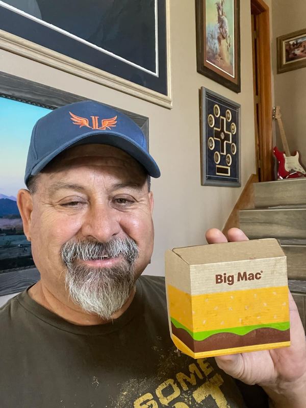 Supporter smiling with a Big Mac