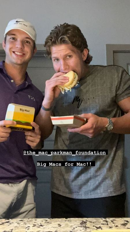 Two friends with Big Macs, captioned Big Macs for Mac